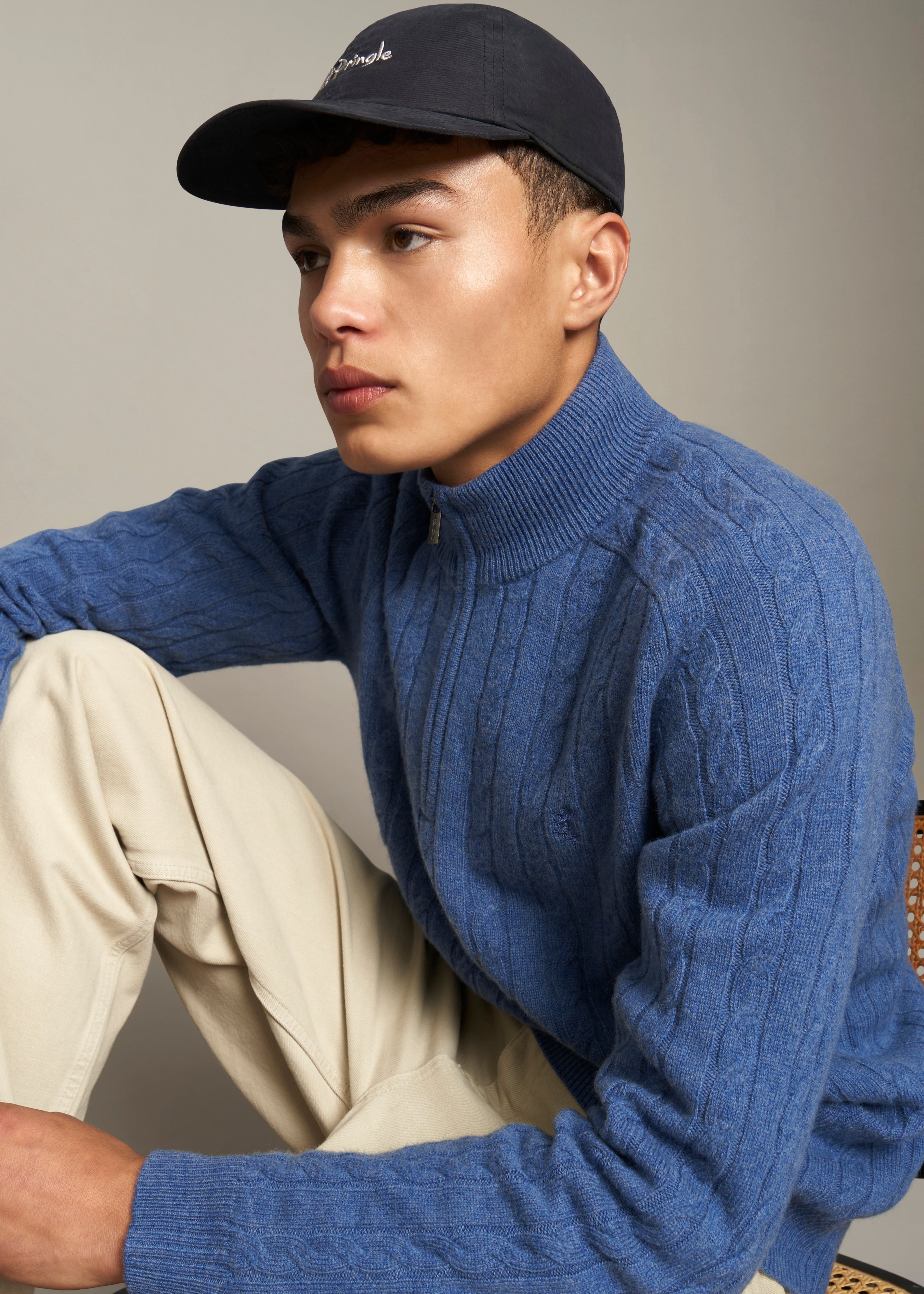 Pringle of Scotland Men's Quarter Zip Lambswool Jumper in Dark Indigo on sitting model