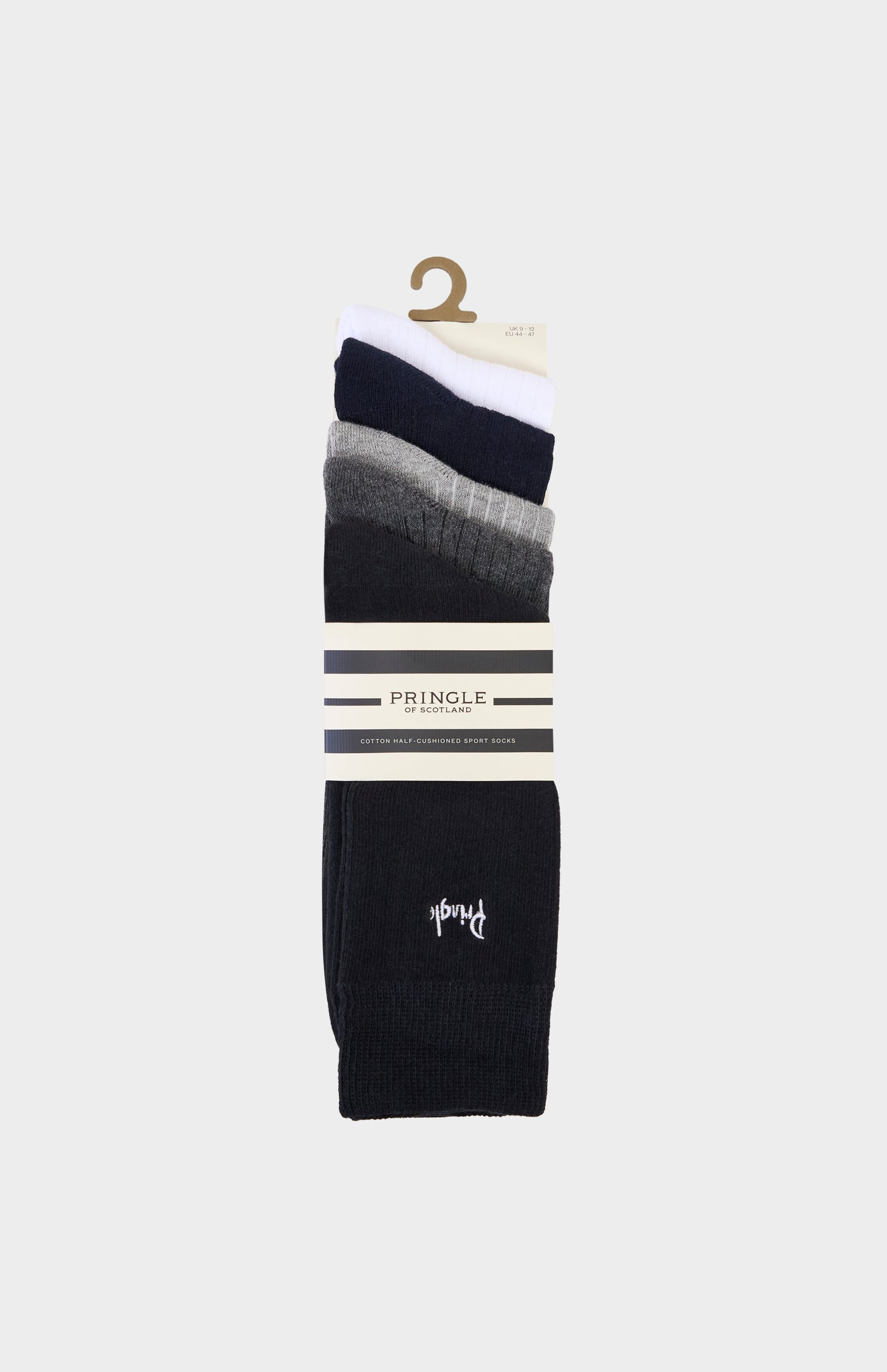 Set of different neutral coloured socks with Pringle branding on a white background