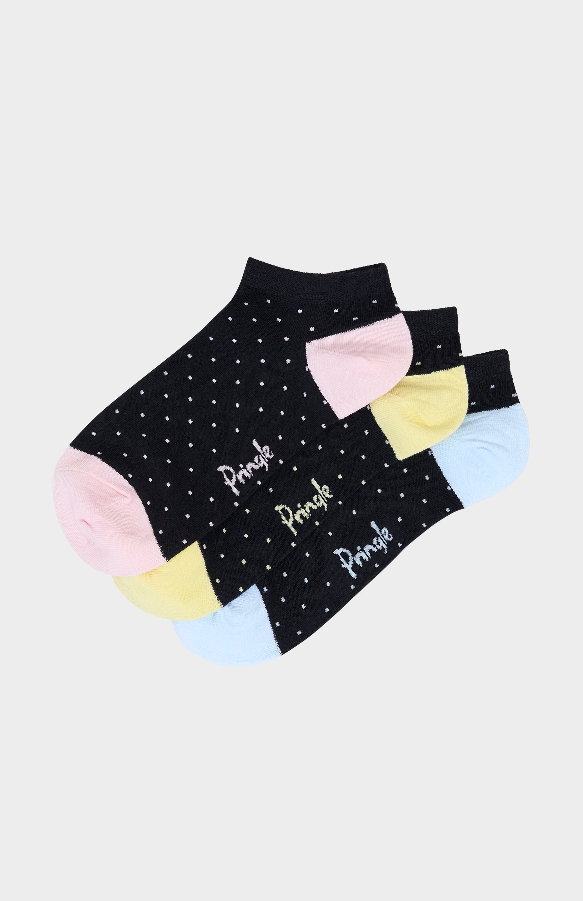 Trainer socks with blue, pink, and yellow polka dots against a white background
