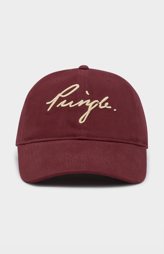 Maroon cap with gold embroidered text on a light gray background