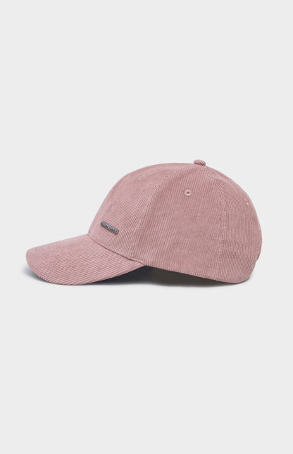 Dusty pink corduroy baseball cap with metal badging on the front