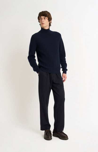 Pringle of Scotland Men’s Cashmere Mock Neck Jumper In Navy Blue on standing model