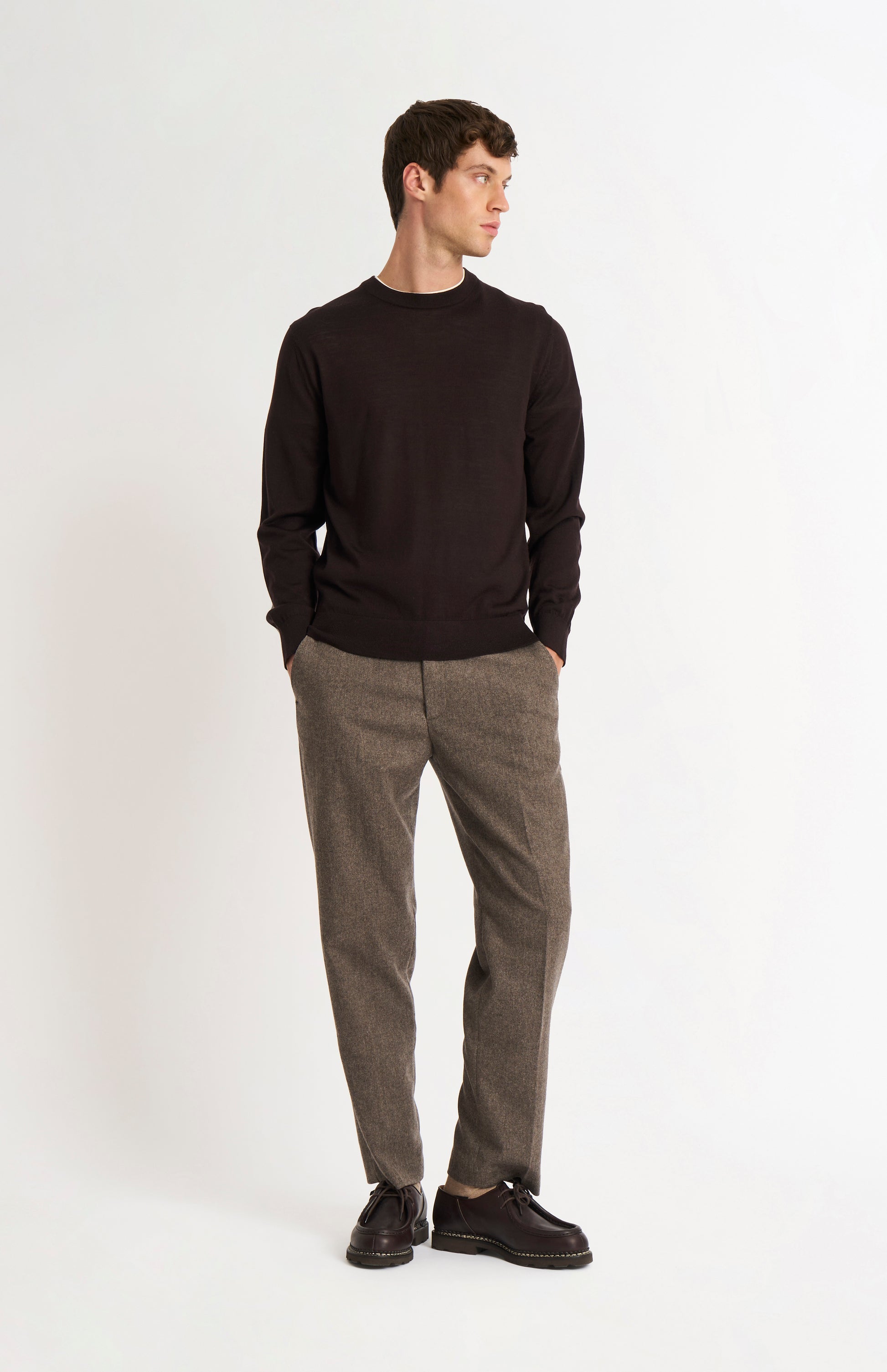Pringle of Scotland Men’s Merino Wool Crew Neck Jumper In Dark Brown on standing model