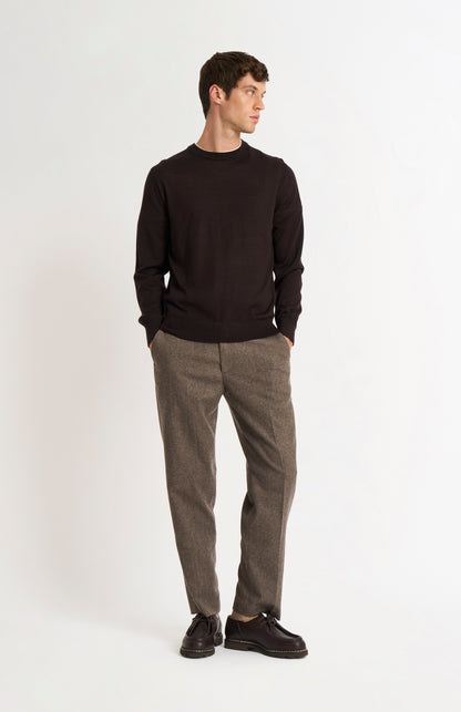 Pringle of Scotland Men’s Merino Wool Crew Neck Jumper In Dark Brown on standing model