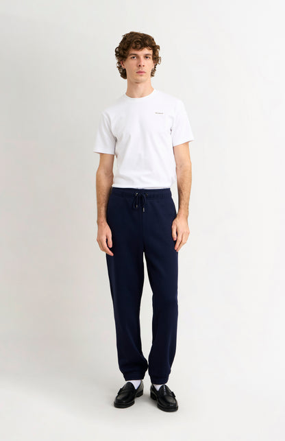 Pringle Men's Track Pants In Navy Blue on model full length