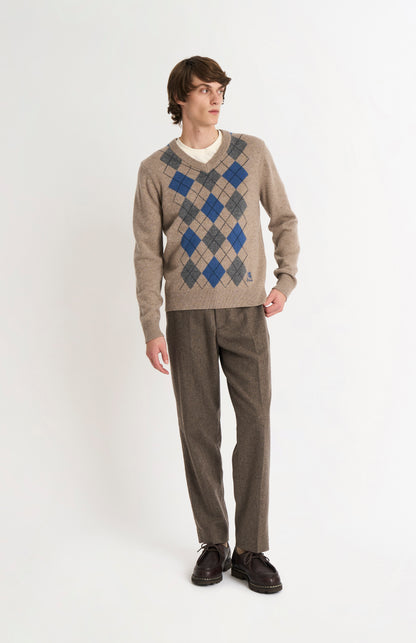 Pringle Men’s Lambswool Argyle V-Neck Jumper in  Mushroom, Blue & Grey on model full length