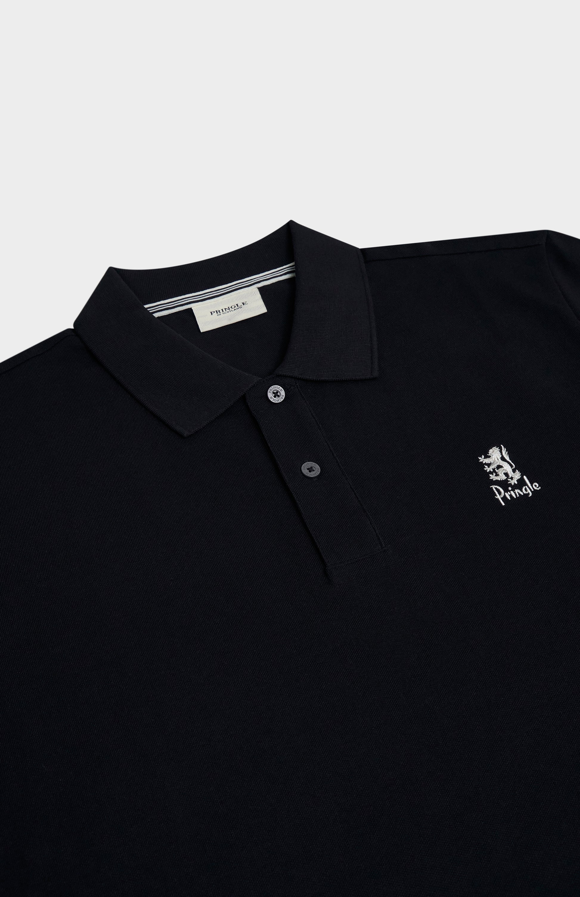 Black polo shirt with a logo on a light gray background