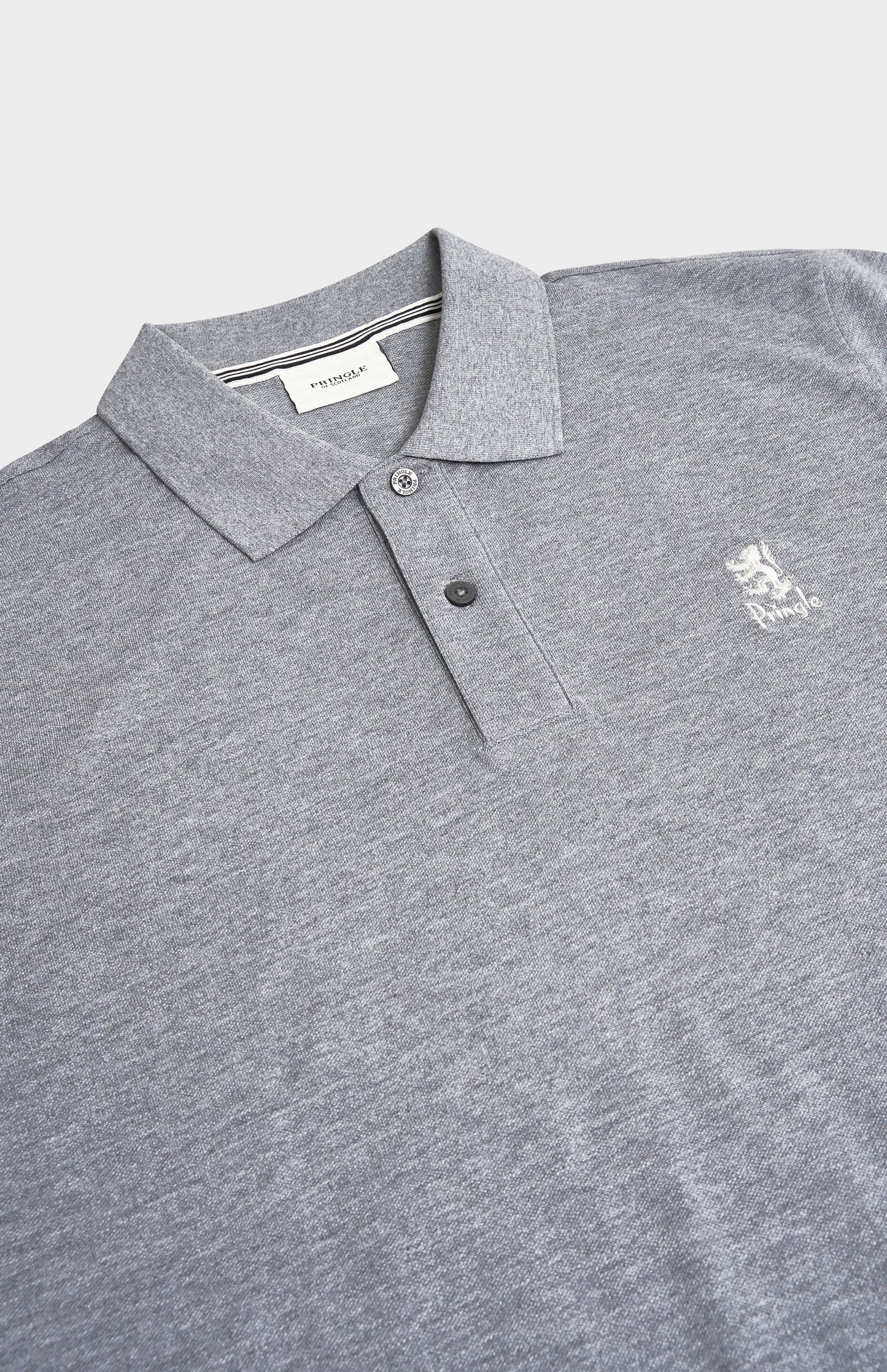 Gray polo shirt with a small logo on a light gray background