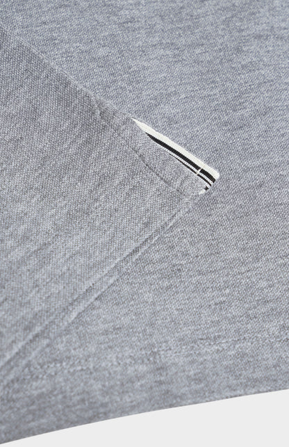 Close-up of a gray polo shirt on a white background