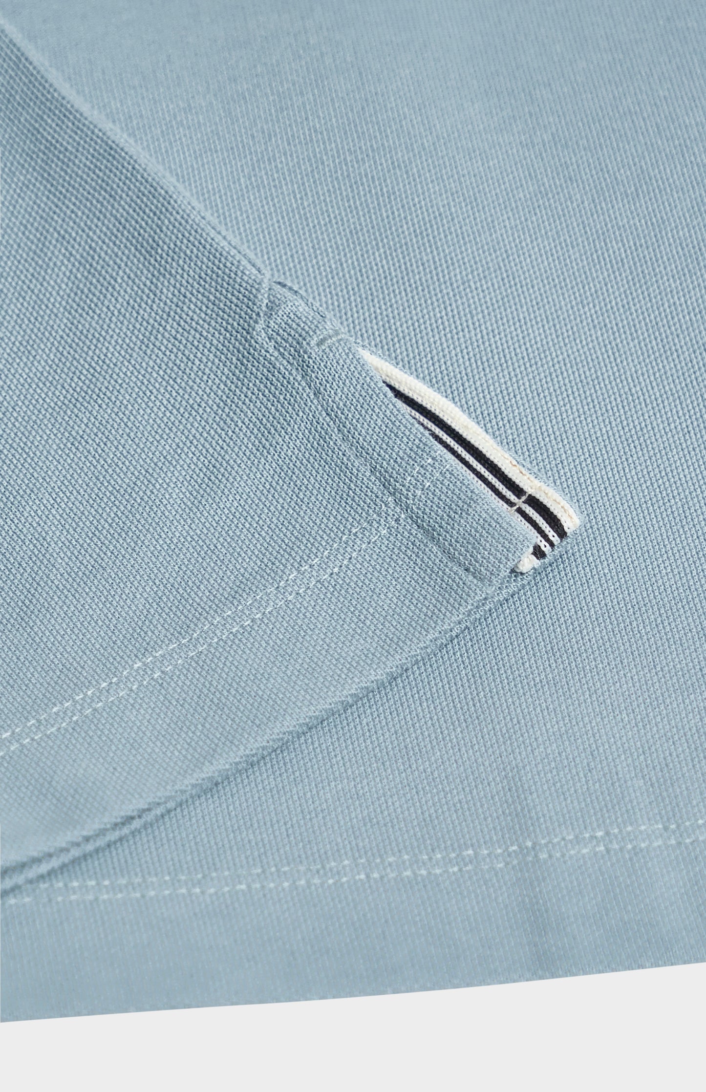 Close-up of a light blue fabric  on a white background