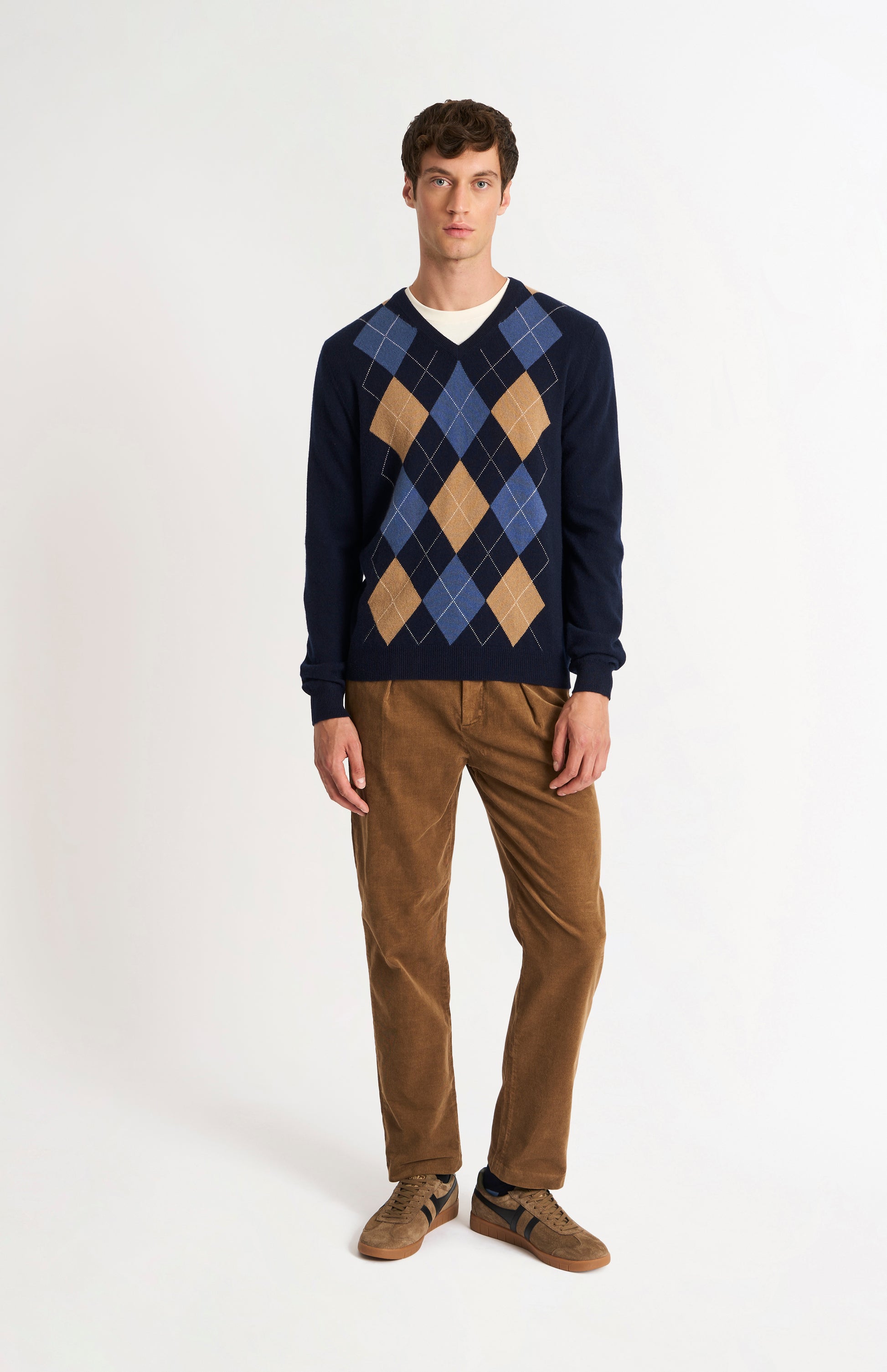 Pringle Men’s Argyle Cashmere V-Neck Jumper In Navy, Camel & Blue on model full length