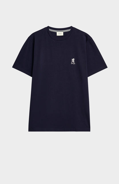 Navy blue t-shirt with a small logo on a light gray background