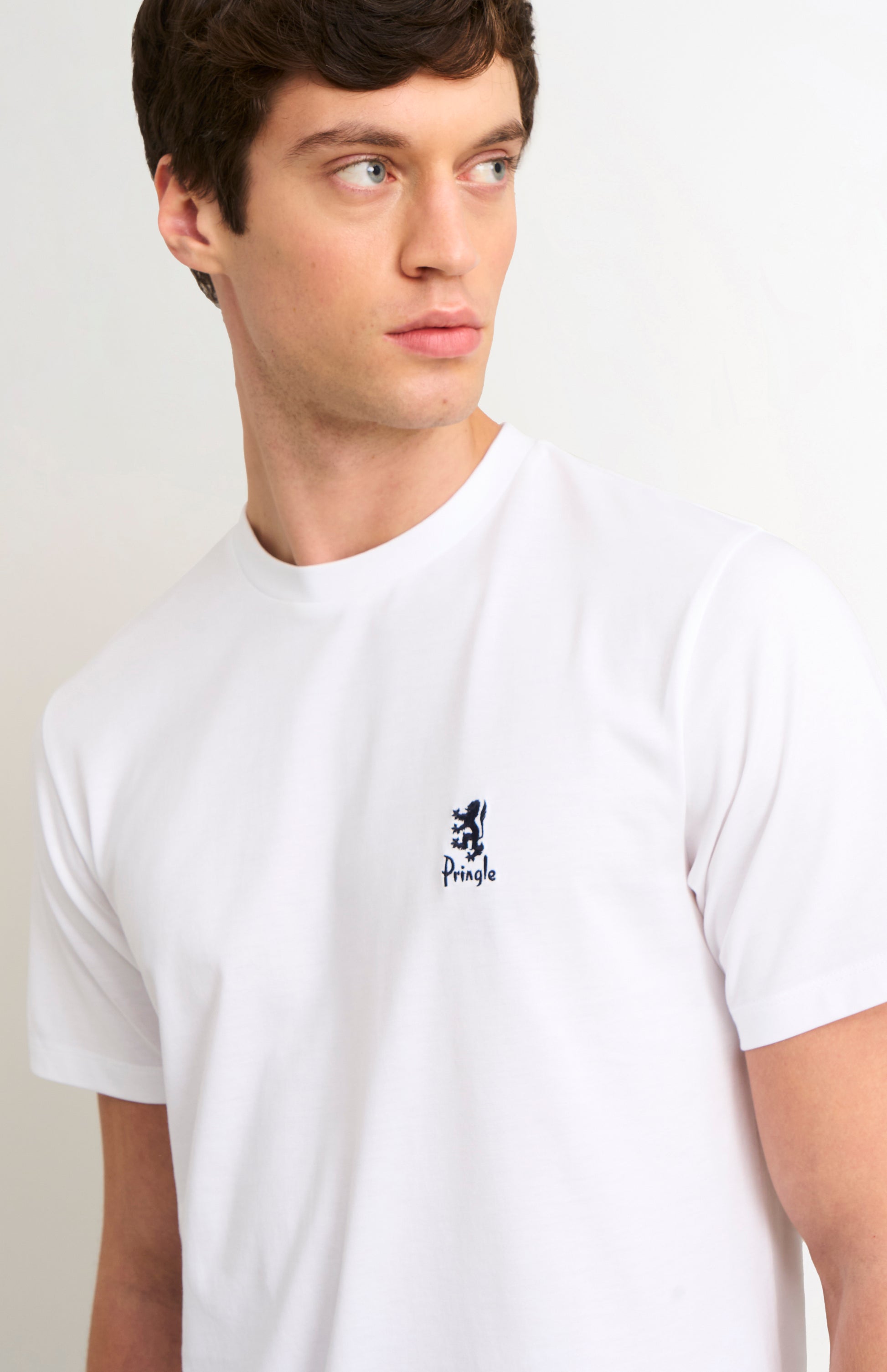 Man wearing white t-shirt and on a white background