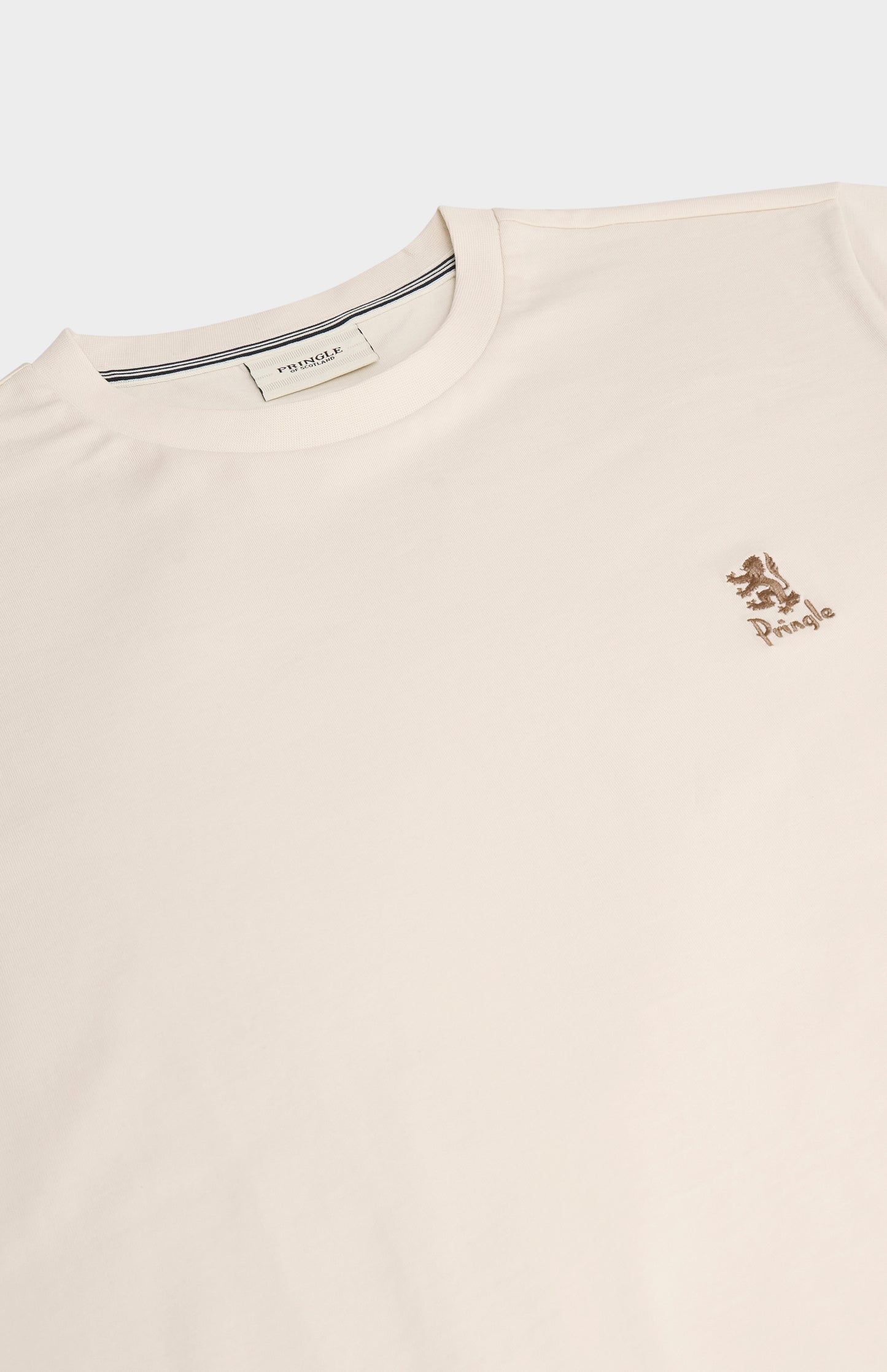 Beige t-shirt with a small logo on a white background