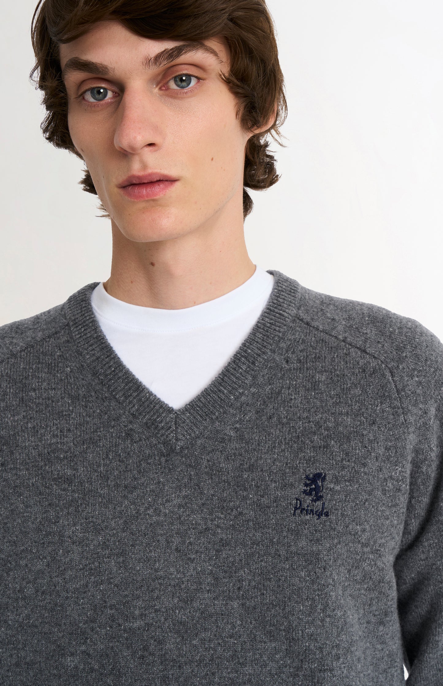 Pringle of Scotland Men’s Lambswool V Neck Jumper In Grey Melange showing embroided logo