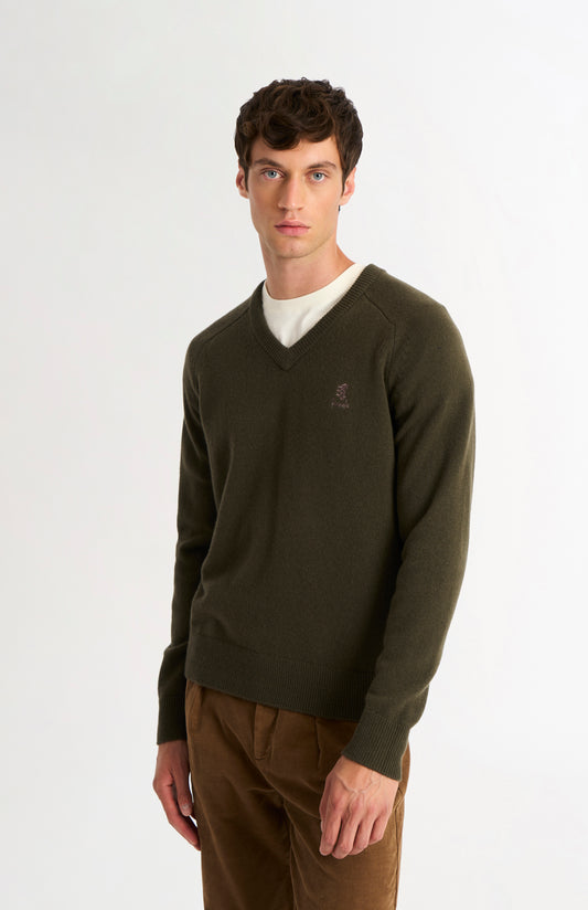 Pringle of Scotland Men’s Lambswool V Neck Jumper In Dark Olive on model