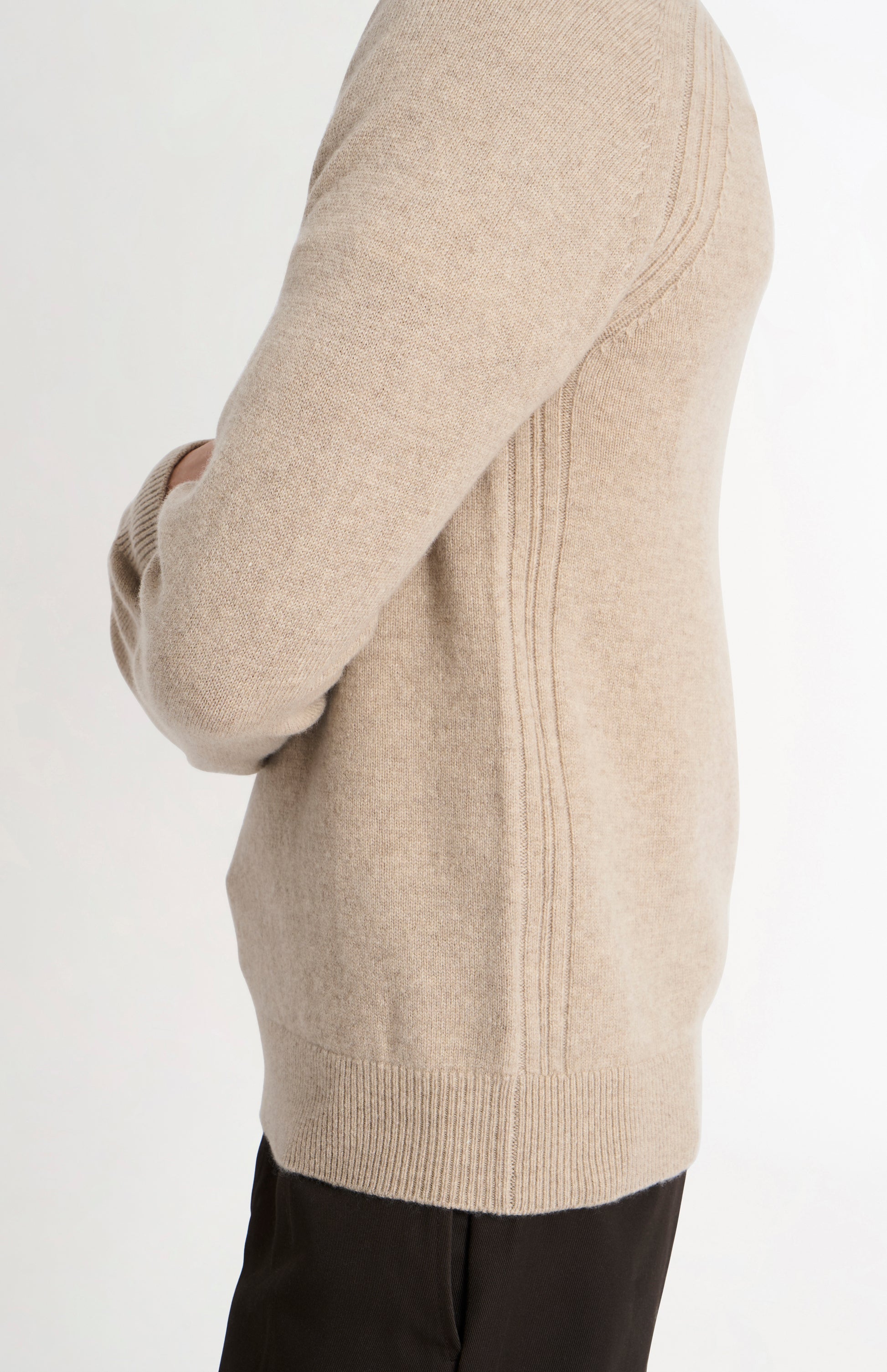 Pringle of Scotland Men’s Lambswool V Neck Jumper In Oatmeal side view on model