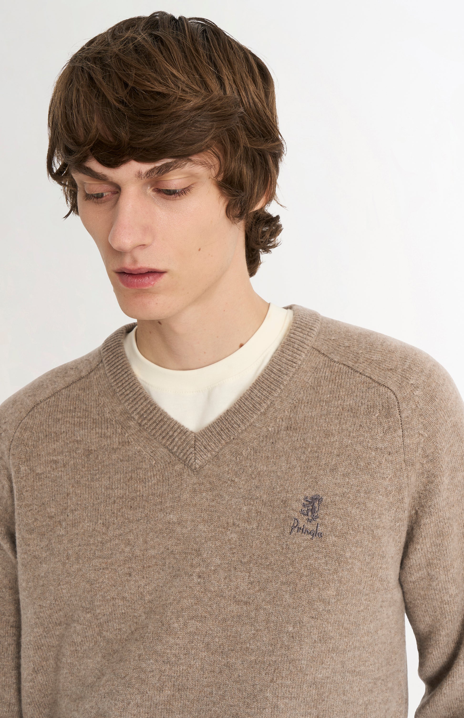 Pringle of Scotland Men’s Lambswool V Neck Jumper In Mushroom showing logo embroidery