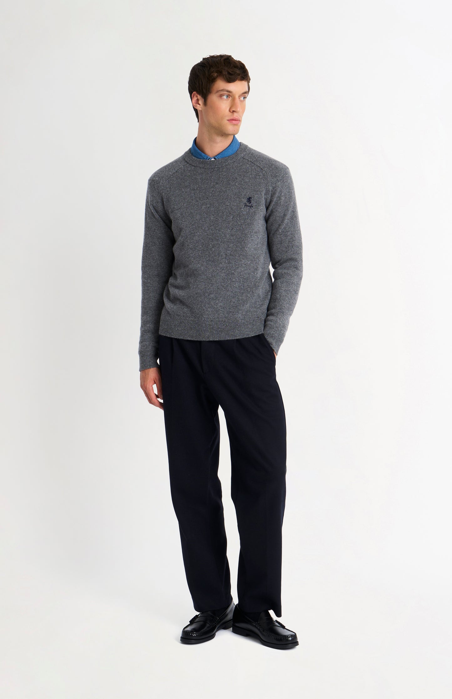Pringle of Scotland Men’s Lambswool Crew Neck Jumper In Grey Melange on standing model