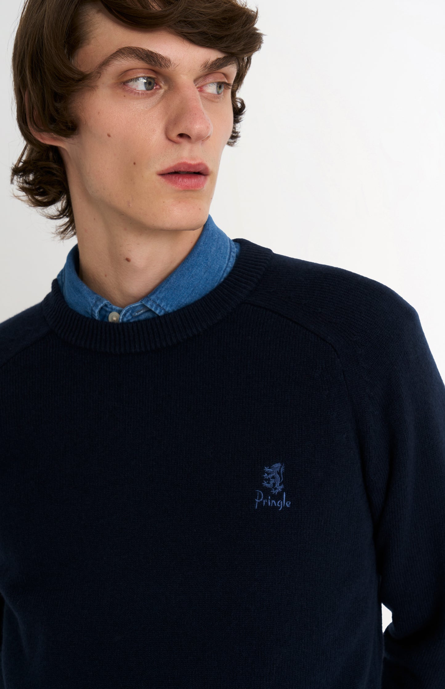 Pringle of Scotland Men’s Lambswool Crew Neck Jumper In Navy Blue showing neck detail
