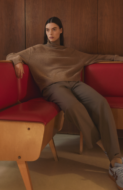 Woman wearing a Pringle of Scotland high neck cashmere jumper