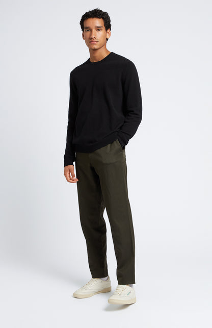 Men's Scottish Cashmere Round Neck Jumper In Black on model full length - Pringle of Scotland