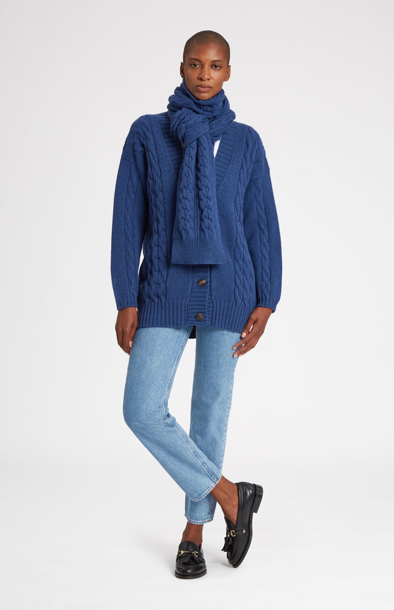 Rib and Cable Wool Scarf in Storm Blue on model full length- Pringle of Scotland 